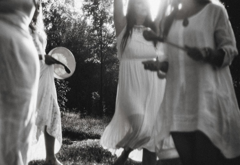 Women dancing together during ceremony